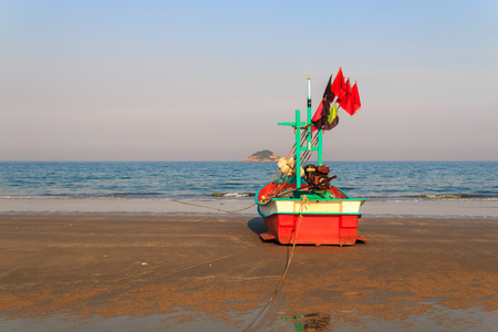 fishing boat waiting on the beach for high tide : Hua Hin  Thailandの写真素材