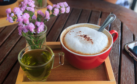 cup of coffee on wood tableの写真素材