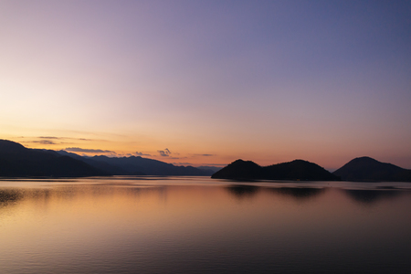 scenery of lake and mountain in  the evening at Srinagarind dam, Kanchanaburi ,Thailandの写真素材