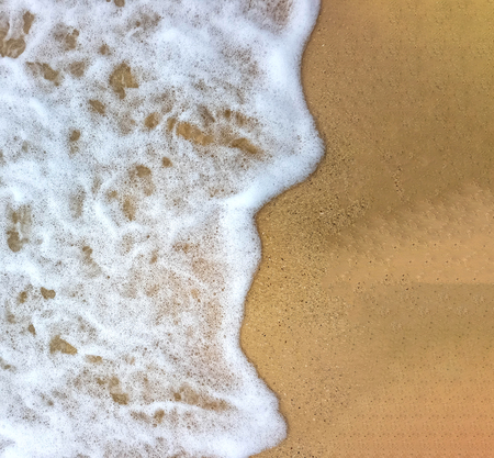 wave on brown sand beachの写真素材