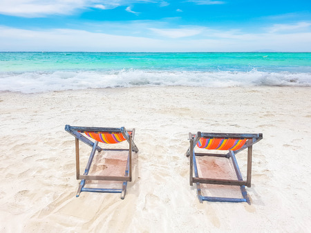 clorful beach chair on the beach with beautiful sky on sunny dayの写真素材