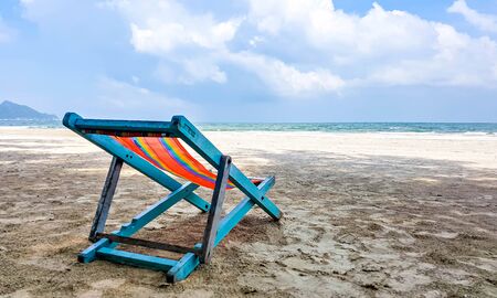 clorful beach chair on the beach with beautiful sky on sunny dayの写真素材