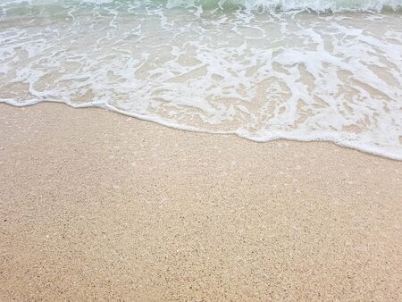 wave on brown sand beachの写真素材