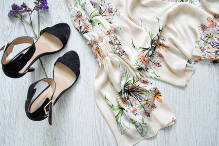 Sleeve flower blouse, black shoes shoes. Fashionable concept.の写真素材