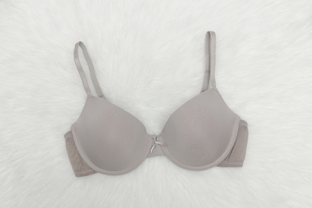 Beige bodice on white fur. Fashionable concept.の写真素材