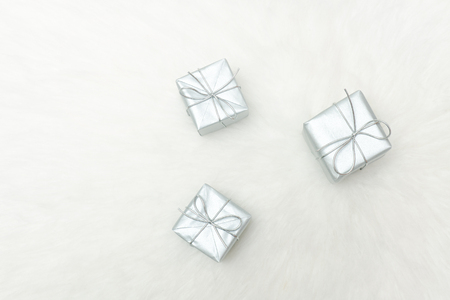 Three silver gift boxes on a white background. Holiday conceptの写真素材