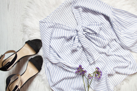 White shirt with blue stripes, black shoes and flowers. Fashionable conceptの写真素材
