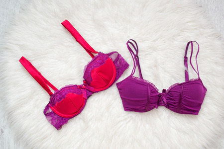 Two colored bra on white fur. Fashion conceptの写真素材