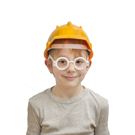 Boy in the helmet of the builder and glasses. Isolateの写真素材