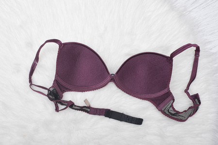 Purple satin bra inside on the white fur. Fashion conceptの写真素材