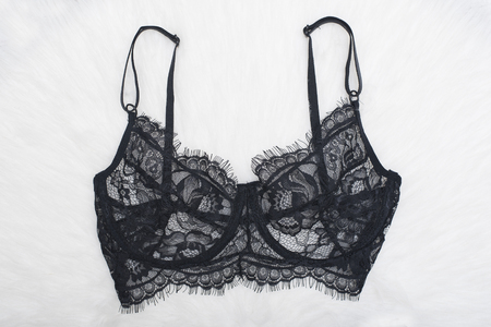 Black lace bra on the white fur. Fashion conceptの写真素材