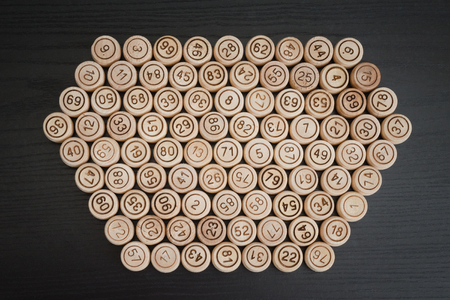 Wooden kegs on a black background. Top view