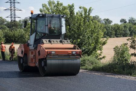Road roller on asphalt. Summer sunny dayの写真素材