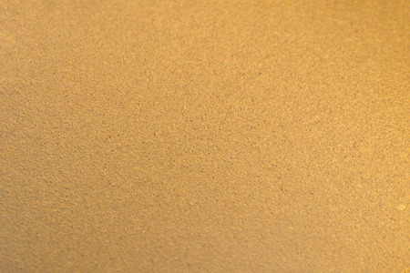 Wall painted with bronze paint. Gradient texture.の写真素材