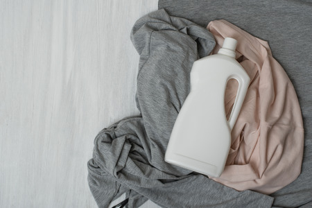 Clothes and bottle with detergent. Top viewの写真素材