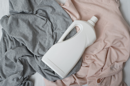 Clothes and bottle with detergent. Top viewの写真素材