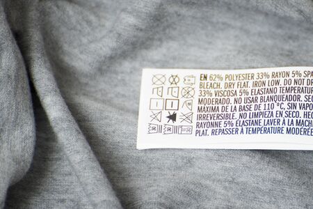 KHARKOV, UKRAINE- OCTOBER 03, 2018: Tag with the size and composition of the fabric on clothing. Inner side of clothesのeditorial素材