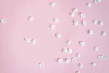 Backgrounds and textures. White apricot petals on a pink background. Close-up.の写真素材