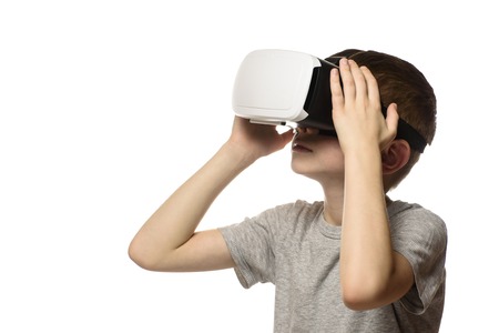 Boy experiencing virtual reality. Portrait. Isolate on white background. Side view. Technology...