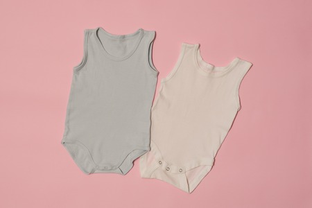 Blue and white baby bodysuit on a pink background. Fashion conceptの写真素材