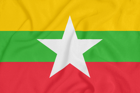 Flag of Myanmar on textured fabric. Patriotic symbolの写真素材