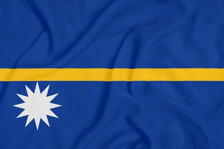 Flag of Nauru on textured fabric. Patriotic symbolの写真素材