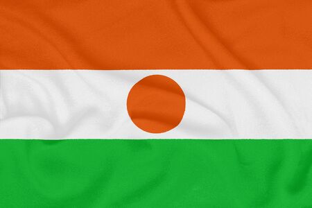 Flag of Niger on textured fabric. Patriotic symbolの写真素材