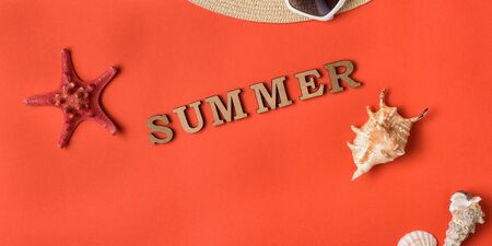 Word Summer from wooden letters. Starfish. and seashells. Live coral background. Travel concept