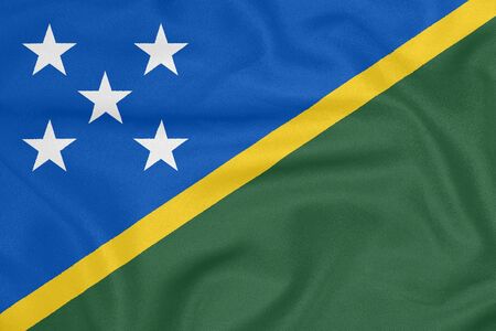 Flag of Solomon Islands on textured fabric. Patriotic symbolの写真素材
