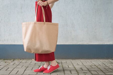 Big eco bag shopper. Young woman. Copy space