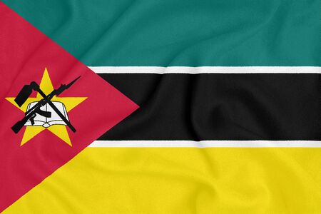 Flag of Mozambique on textured fabric. Patriotic symbolの写真素材