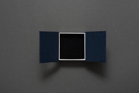 Open empty black jewelry box. Present. Black backgroundの写真素材