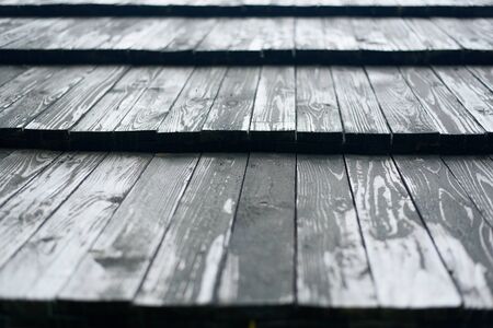 Old roof made of gray wooden planks. Close up.の写真素材