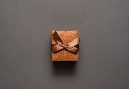 Brown closed jewelry box. Present. Black backgroundの写真素材
