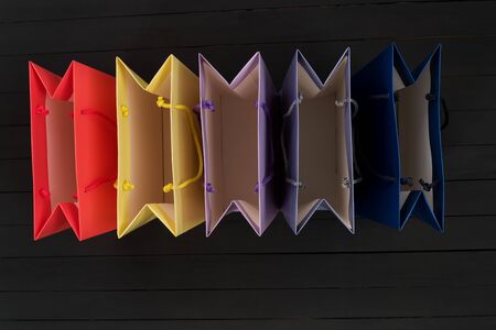 Five empty multi-colored shopping bags. Top view. No shoppingの写真素材