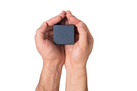 Black square small box in man hands. Present. White background. Top viewの写真素材