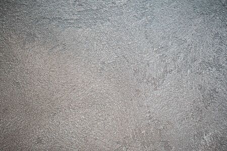 Roughly plastered gray wall. Backgrounds and textures.
