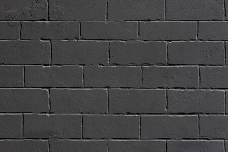 Black grunge loft styled brick wall. Background.
