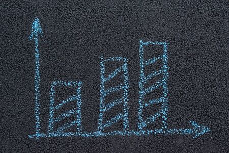 Growth concept. Chalk drawing on surface of road. Black asphalt.