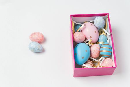 Easter eggs in pastel colors in box on white background. Happy Easter.の写真素材