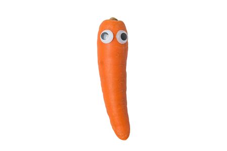 carrot with Googly eyes and funny face on isolated white background.の写真素材