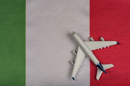 Flag of Italy and model airplane. Resumption of flights after quarantine. Flights to Italy.の写真素材