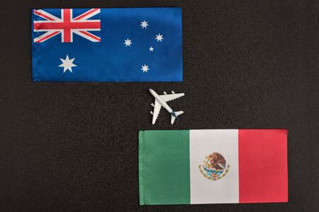 Flag of Mexico and Australia and small airplane. Flights from Mexico to Australia concept. Mesatlantica flights after quarantine.の写真素材