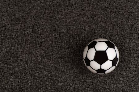 Small toy soccer ball on black background. Close up.の写真素材