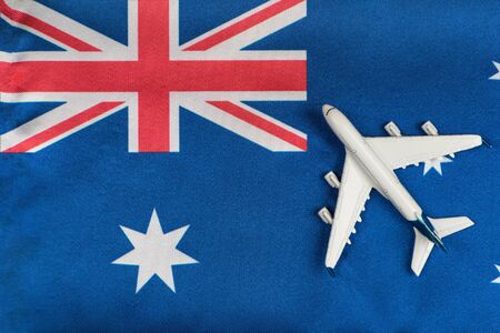Flag of Australia and model airplane. Flights to Australia after quarantine. Mesatlantica flights.の写真素材