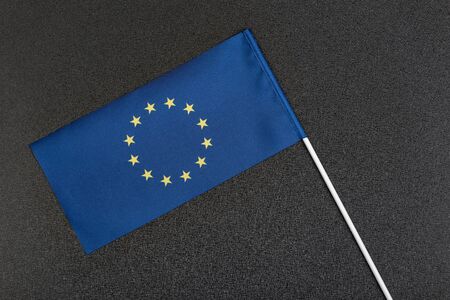 European Union flag on a black background. Small blue flag with stars.の写真素材