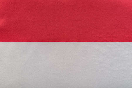 National emblem of Poland. Flag of Republic of Poland on close up. Red and white flag.