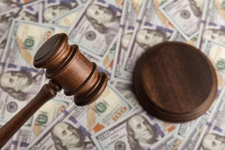 Judges gavel and the money. Dollars and justice. Corrupt court. Trial of money scammers