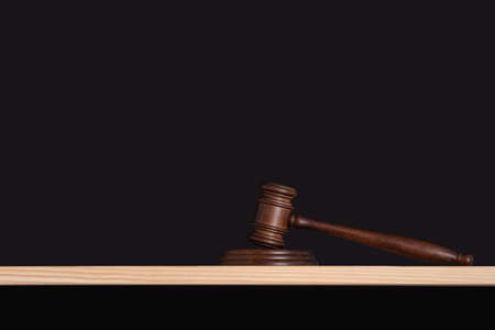 Mallet of the judge on black background. Judges gavel. Hammer auction.