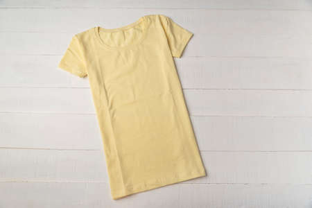 Yellow blank t-shirt unisex white background. Mockup. Knitted cotton t-shirt.の写真素材